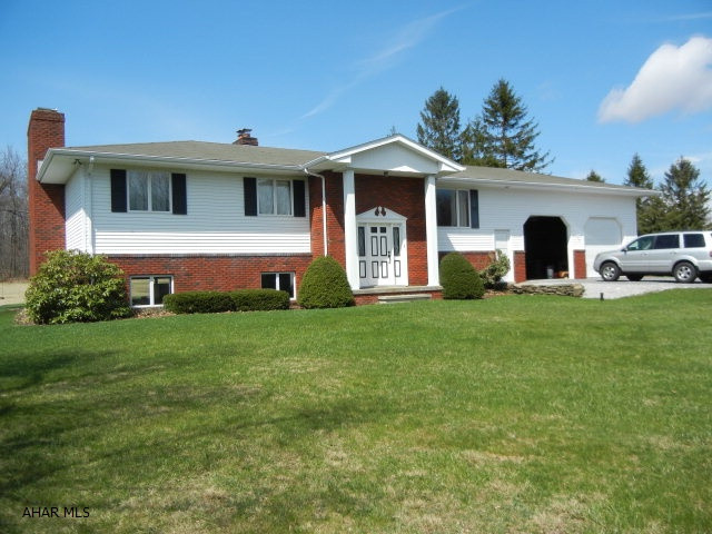 Pre-sale inspection.  Minor repairs completed. Huge partially finished lower level with updated full bath. Area ready to be completed. Includes beautiful stone fireplace. Direct access to garage and exterior. Oversized attached 2 car garage with full size storage loft. Large air conditioned Sunroom overlooking expansive backyard bordering state game lands.  Enjoy many kinds of wild life in your own back yard.
