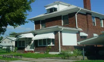 Classic brick home in Juniata with hardwood floors, natural woodwork, modernized kitchen and bath and so much more!