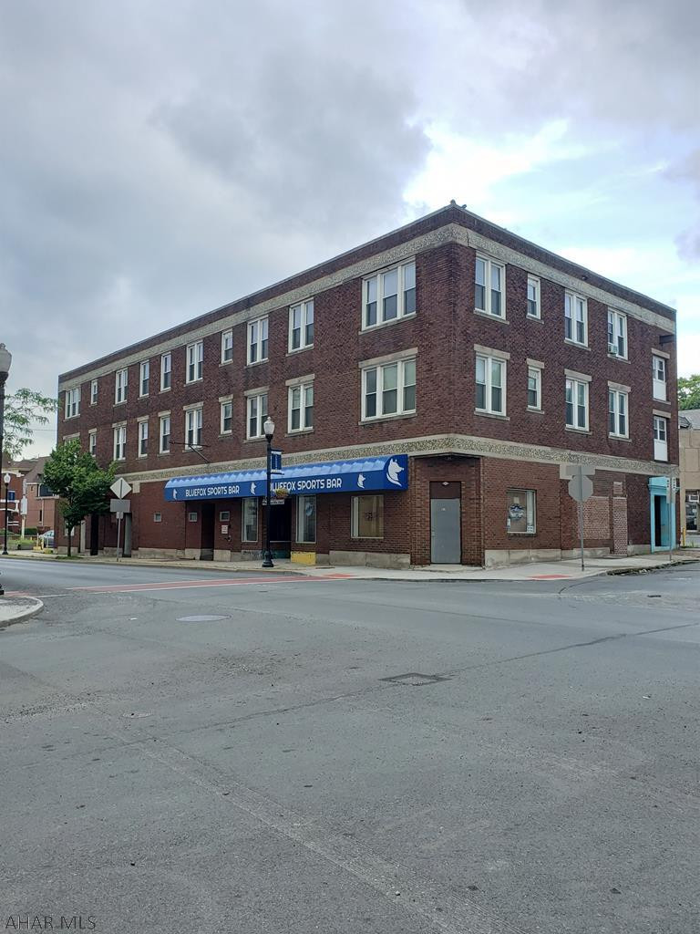 Excellent Investment Opportunity.  This building has all so many possibilities.  The First floor houses the Blue Fox Sports Bar, while the top 2 floors are made up of 8 One-bedroom apartments.  Most of the mechanics have been recently updated.  The Liquor License and all of the bar inventory and equipment are included.