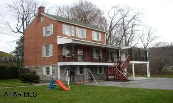 REALLY NICE 3 STORY BRICK. MODERN KITCHEN, LARGE FAMILY ROOM WITH FIREPLACE. ATTACHED 1 CAR GARAGE & A ONE CAR DETACHED GARAGE.