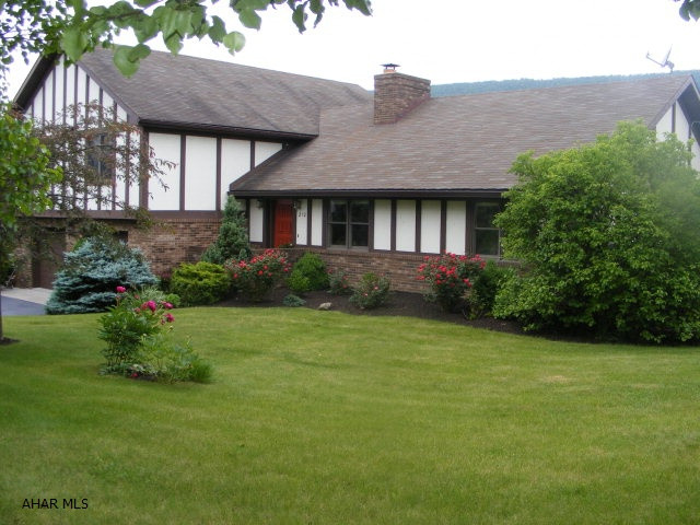 Talk about living space and large bedrooms! This wonderful home boasts 3341 sq ft. of living!Beautifully situated on 1.03 ac with increadible views, this home has a lovely brick fireplace, cathedral ceilings in the living room, private deck off the Master Bedroom, large updated kitchen and 2 family/rec rooms PLUS an additional bedroom/office in the Lower Level. New public sewer and brand new furnace and A/C .Great covered patio w/ tile floor..great for entertaining.