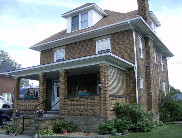 2 1/2 story 4+ BR, 1 1/2 Bath brick home with newer windows & roof. Acrylic counter top W/ stainless steel under mount sink. Newer dishwasher.  LR fireplace, Gas HW Heat.  Large open front porch. Landscaped corner lot. Detached garage.  Move-in condition.