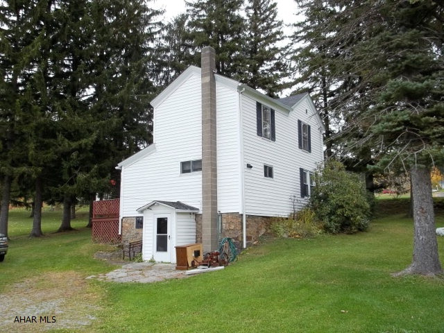 Beautiful views. Mostly flat. 3+ acres. Nice three bedroom 1.5 bath farmhouse.This property should should qualify for Rural Housing.  Great location for horses or livestock, flat with the majority of the property behind the house.  This would allow for more available pasture CITY WATER - CITY SEWERThis would also be a great hunting camp - 2 miles from State Game Lands and a branch of rails to trails.