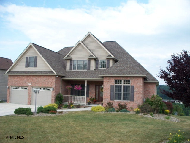 Quality home having great views.  Large 1st floor bedroom with full bath, whirlpool tub, and double bowl sink.  First floor den could be office or 5th bedroom.  Oak floors, doors, and trim.  Jack and Jill bathroom and three bedrooms on the second floor.  Extra large family room.  Gas fireplace in living room.  Front porch.  Rear screened porch.  Deck and patio.  Nicely landscaped.  Seller is a licensed real estate agent in the State of Pennsylvania.