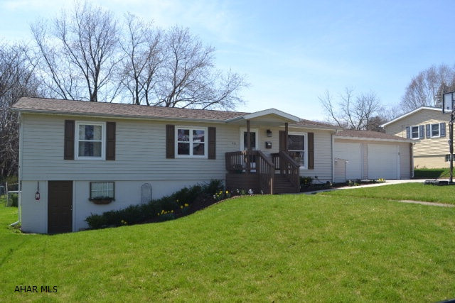 If you are looking for move-in ready, this is it! This sensational single story has been meticulously maintained with great pride by its owners. The main level offers 3 BR, an adorable updated bath, & a wonderful open living & dining floor plan that leads to a back porch and yard that you are sure to enjoy this summer!  The basement has plenty of addl living space with a large family room (pool table incl), cedar closet, workshop/storage(could easily be converted to a bedroom, office, etc), & bath.  Attached to the home is a large 2 car garage that is sure to get good use.  Backyard has a screened area of the porch, is a great size & completely fenced.  Home also has newer furnace & Central Air (2005) and newer roof on home & garage (2010). Great neighborhood! All that is missing is Y-O-U!