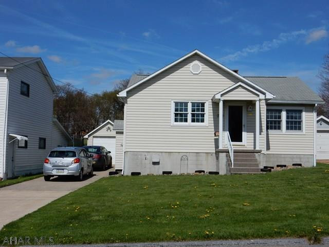 This split-level 2 bedroom (could make 3rd bedroom in lower level) 1&3/4 baths is a must see. Move in ready and a great home for entertaining. It features a wonderful 3 season sun room that lets air in &  bugs out(18.4 x 18.4)! It has a cold closet for your root veggies/sodas/drinks. Parking is good with a 1 car garage and concrete drive-way that fits at least 3 more cars. Get your projects done in the workshop behind the garage and store your seasonal items in the big attic.(Home also has good closet storage) This home was built with great insulation & electric heat--2016 average for the year was $180.89/month. You'll be happy you looked at this home! (The fire place is set up with a propane insert, but could take it back to wood)