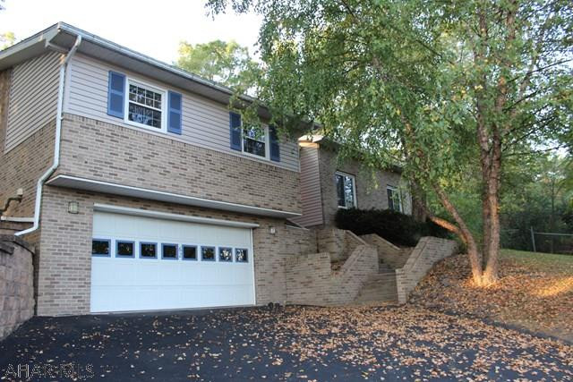 3 bedroom, 2.5 bathroom home in Holiday Manor. Large yard with awesome living space w/ a sunken family room & master bedroom, and if the  idea of a fireplace in your master bathroom sounds nice, this could be your house!  New roof and siding was put on in 2017!