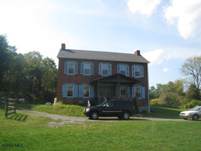 Rustic on the outside, modern on the inside.  Large rooms.  3 BR, 2 BT, with a detached 3 car garage with workshop upstairs.  Everything has been redone.  All on 5 acres.  Call for your personal tour.