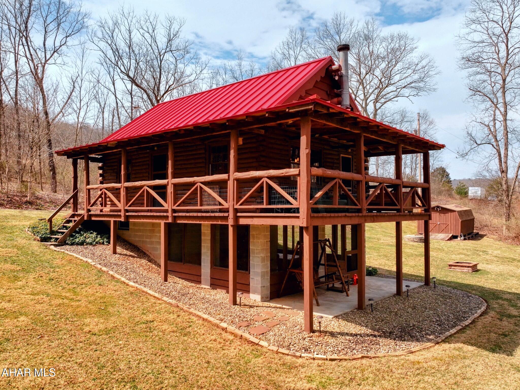 Discover the perfect getaway with this cozy 2-bedroom, 1-bathroom cabin nestled on a scenic .54-acre lot in the peaceful community of Cliff Side Acres in Everett PA. Boasting approximately 700 sq ft of comfortable living space, this riverfront retreat offers a rare blend of privacy, charm, and unbeatable views. Step outside to a spacious covered porch where you can relax and take in breathtaking views of the river—an ideal spot for morning coffee or evening sunsets. Inside, the cabin features a vaulted ceiling living area with a woodstove, a main floor bedroom and an open loft sleeping area, making it perfect as a weekend escape, vacation rental, or year-round residence. Whether you're looking for a peaceful retreat or a riverside adventure, this charming cabin offers the best of both worlds. Don't miss your chance to own a slice of paradise in Bedford County!