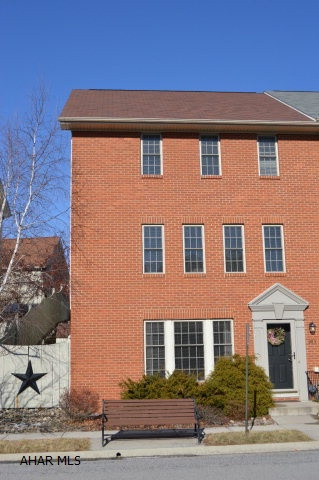 Spectacular updated 3 story townhome not only offers a spacious and well maintained living space but is also located in a perfect area within Hollidaysburg. This move in ready townhome is a coveted end unit in Sweet Cherry Court. Oversized and spacious layout makes this townhouse one of the largest on Sweet Cherry Court.The first floor offers a cozy area with a family room, gas fireplace, hardwood floors, full bathroom, laundry room and storage. All new stainless steel appliances. 3 Bdrms, 2 full baths, 1 Half Bath, 2 car detached Garage, large walk in closet in master bdrm and cherry hrdwd floors and cabinets. Beautiful mountain views from the upper open deck and newly built screened in porch. Beautifully landscaped front and back.