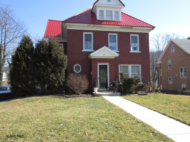 Four spacious bedrooms, large foyer, 2.5 bathrooms, large living and dining rooms with custom woodwork throughout, large porch grace this main house.Three additional apartments add to the economic value of this property. Separate entrances and appliances included with each unit. The convenient in-town location adds to its appeal. The full finished recroom presently used by the main home could also be turned into another apartment adding to the profit of this superb property. Apartment 1st fl: Kitchen 16x12,LR 14x12,BR 14x10,BA -Apartment 2nd fl: LR 15x15,Kitchen 11x11,BR 11x10, BA- Apartment 3rd fl: LR 11x14, Kit/din 14x11, BR 17x11,BR 16x14, BA
