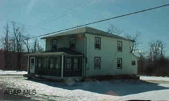Located atop the Buckhorn aross from the Buckhorn Inn. New windows, multi fuel furnace, .71 acres that abuts City Authority property.