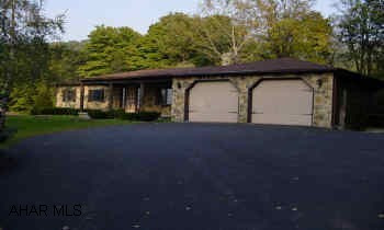 Breathtaking view, 6.16 partially wooded acres, mountain stream, secluded, borders state game lands, attached two car garage, integral one car garage, 4 car open garage with attached  shed, pavilion, central air, central vac, office. 40 Year shingles, 12 inch foundation walls, two wells, central air, central vac, equipment in place for backup emergency electric generation. Extraordinary view. Ultimate country living!
