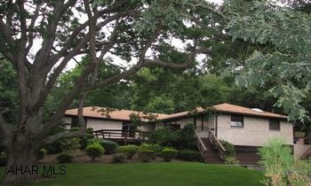 Udated Brick Ranch on approx 10+ acres Sprawling Brick Ranch on 10+ park like acres seconds from downtown Bedford, but feels like your miles away.  Entertain in the large pool house with wet bar kitchen and half bath.