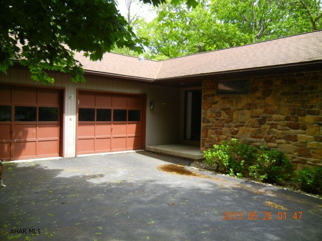One story in Hollidaysburg School District with large level and full length deck with canopy cover. Beautiful kitchen with sun room, first floor laundry, larger than it looks. Approx 2400 sq. ft. A must see in Holiday Manor, Hollidaysburg School District located on cul-de-sac! Large LR with cathedral ceilings, french doors to deck, master bedroom with walk out to full length deck, partially canopy covered. 2 bedrooms on lower level. Updated master bath with jacuzzi tub and shower, beautiful cherry kitchen with corian counter tops, sun room off kitchen to enjoy the beautiful scenery. Irr lot 97x74x102x56.