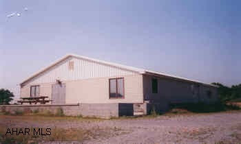 3200 SQ. FT. RETAIL OFFICE STORAGE BUILDING ON 16.504 ACRES. 11 YEAR OLD BUILDING WITH 2 YEAR OLD ADDITION. BASEMENT UNDER 2200 SQ. FT. WITH INTEGRAL (HIGH OVERHEAD DOOR) GARAGE. (ARCHERY BUSINESS NOT INCLUDED)