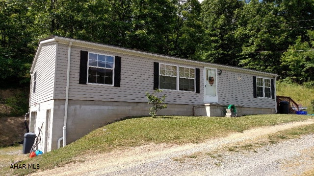 2003 Fleetwood-28X48 on foundation w/1 car integral garage, full storage w/walkout basement, above ground pool w/all equipment.