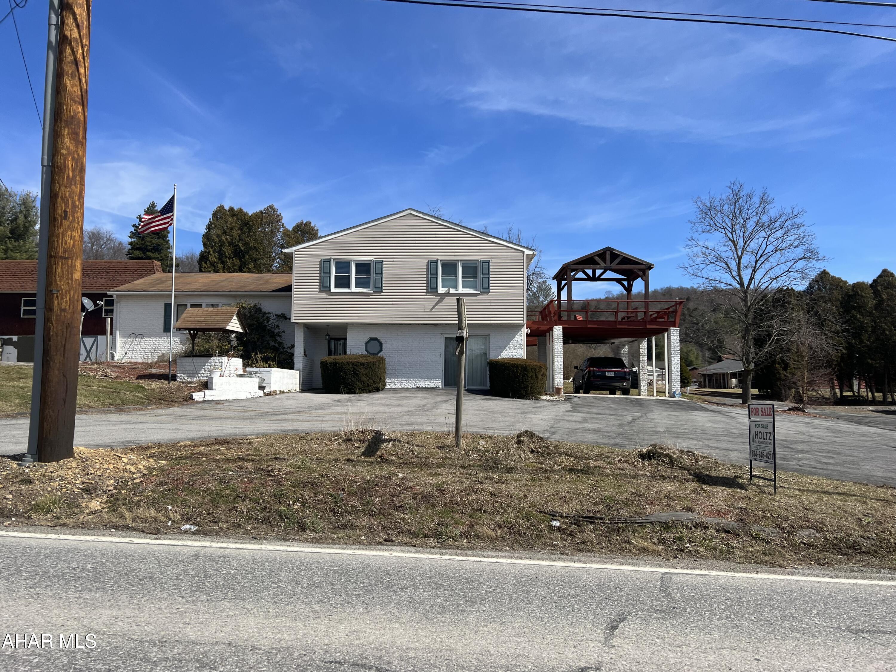 Split level home on approx 0.68 acre a short drive from Prince Gallitzin State Park. This home features 4 bedrooms 2 baths and laundry on the upper level, living room, dining room and kitchen on the middle level.  The lower level has a family room, game room and half bath.  There is a partial basement. Rear covered deck, patio and side carport. There is a detached oversized two car garage, paved driveway and a large storage shed.