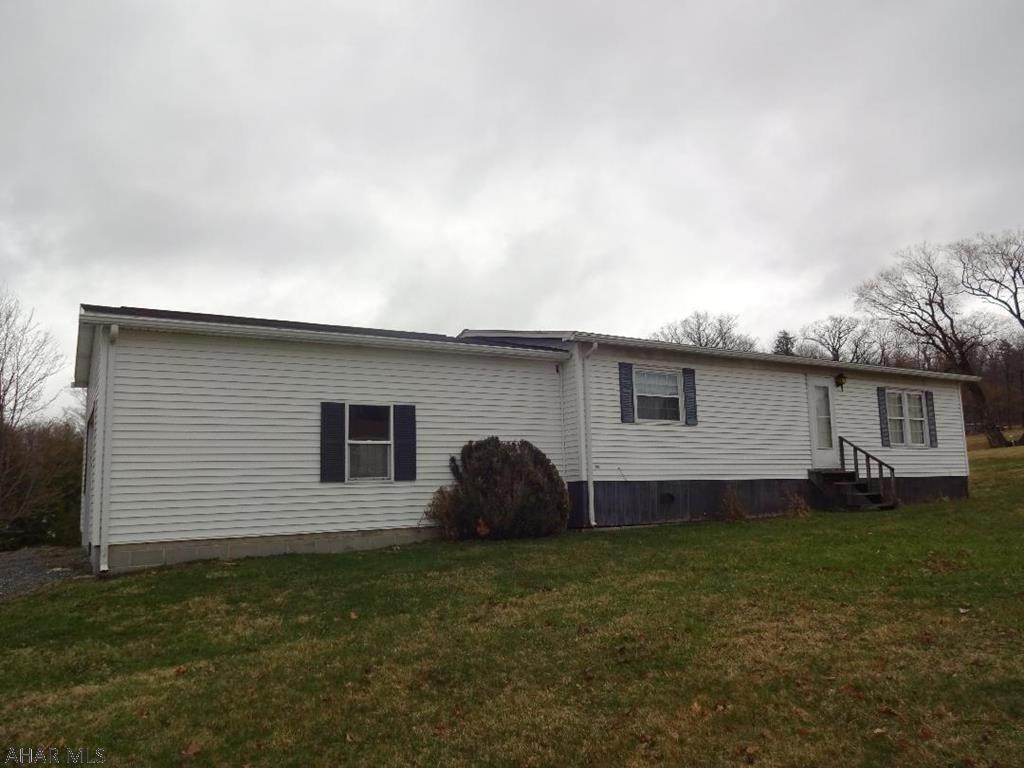 Nice private setting 1987 mobile home w/ gabled asphalt shingled roof. New vinyl windows. Transfer of warranty available to buyer. Situated on an acre, Move in ready,One car attached garage & utility shed