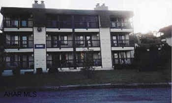 1BR condo, 3rd floor, sleeps 6, furniture included.  Assoc. Dues of $118/mo includes trash, cable, exterior maintenance, use of pools and tennis courts.