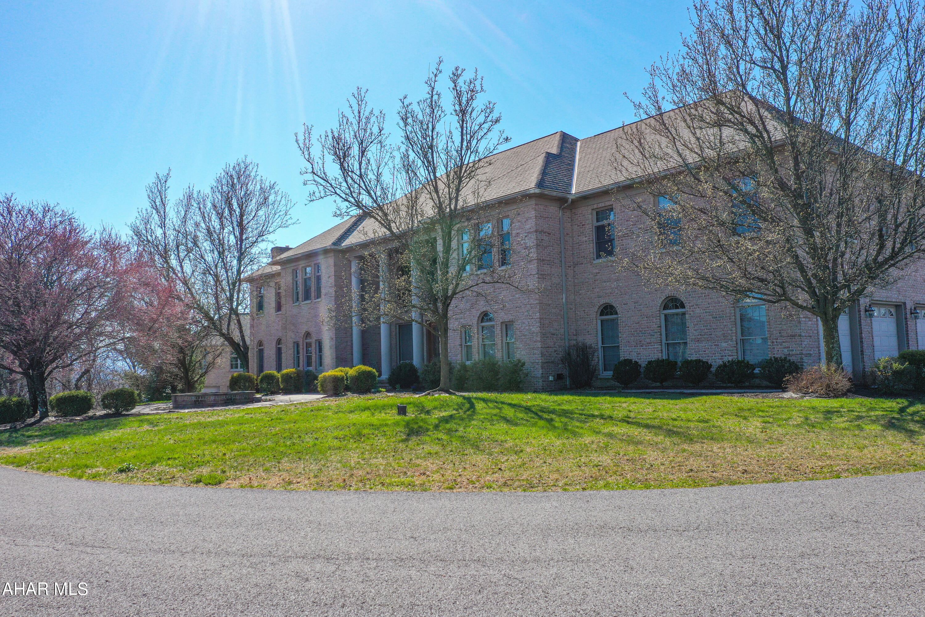 WOW! There is so much to this property!  All brick custom design home located on 4.23 
The interior of the home boasts 5-6 bedrooms, 6 full and 2 half baths, and stunning hardwood and ceramic floors throughout. The formal living and dining rooms are perfect for entertaining, while the bonus (piano) room with a wall of windows is a bright and welcoming space to relax or practice music. The oak woodwork throughout the house showcases exceptional craftsmanship.

The kitchen is equipped with an eat-in nook and leads to a deck overlooking the spectacular view. The master bedroom suite features a large sitting room, fireplace, and master bath.  

The lower level features a living room area with a walk-out to the patio and an in-ground heated pool with optical lighting for relaxation and entertainment. The finished attic with hardwood floors and a ballet bar adds a unique touch of versatility to the property.

To ensure comfort and efficiency, the house is equipped with 4 forced air furnaces.

The incredible views from the property add to the value of this home, offering a serene and picturesque environment.

Don't miss the opportunity to own this exceptional and luxurious property. Schedule a viewing today to experience everything that it has to offer.
