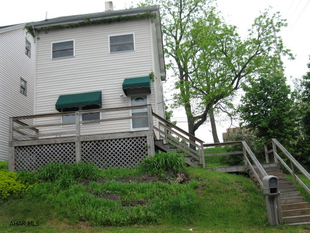 AS IS - SITS ON DOUBLE CORNER LOT. GREAT FOR HANDYMAN OR INVESTOR.  2 BED WITH FINISHED ATTIC FOR 3RD OR BONUS ROOM.  FIRST FL LAUNDRY AND UPDATED KITCHEN AND BATH, POSSIBLE FREEZE DAMAGE.