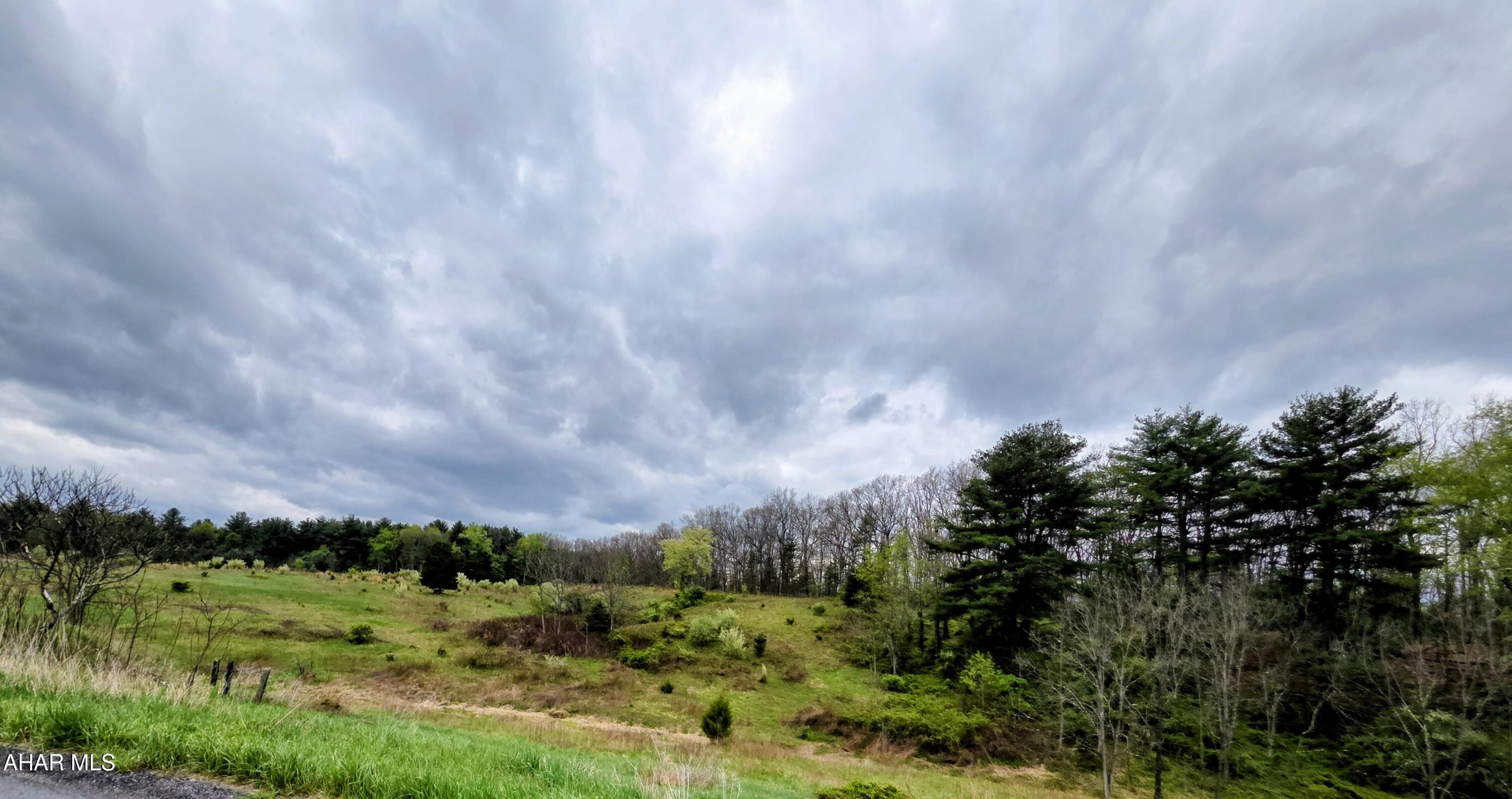 Imagine campfires, quiet mornings, and the perfect blend of privacy and opportunity with this 18 acre property in beautiful Bedford County... 

18.241 acres of wooded and cleared land with an artesian well.  Lots of wildlife to see, hikes to be taken, farming, four wheeling, hunting or just relaxing.  It's all here waiting for you to build your dream home, create a hunting retreat or just enjoy what life is all about.

There is an existing homesite with outbuildings, however the home is uninhabitable.  There also was a septic system that hasn't been used in 30 plus years.  Property has an artesian well and electric already hooked up.