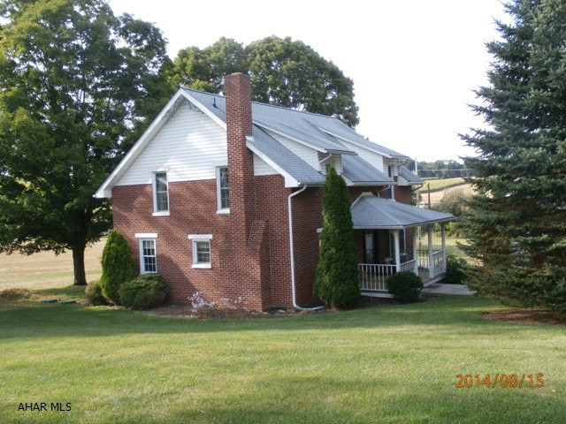 Country living minutes from town! Beautifully restored brick 4BR, 2 1/2 bath home on almost 2 acres. Updated baths- ceramic tile & Jacuzzi tub. Large bedrooms upstairs w/lots of closet space. Downstairs bedroom has a private full bath- nice guest suite. Eat-in country kitchen. Large living room w/ orig. plank flooring open to study w/lovely stone fireplace. Post, peg, & beam 41 x 56 bank barn, spring house, and 30 x 62 garage equipped w/heat, water, & telephone.