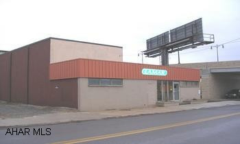 7,000 SQ. FT. OFFICE BUILDING. 708 8TH AVENUE, ALTOONA. 7,000 SQ. FT. COMMERCIAL PROPERTY ON 1.2 ACRES. MODERN FACILITY WITH OFFICE SPACE, FABRICATING AREA, ADDITIONAL STORAGE BUILDINGS. EASY ACCESS. $175,000.