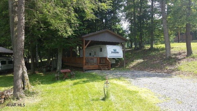 30' 2001 Prowler 5th wheel camper on two lots inside Glendale Yearound. This camper has a double bed and a bunk bed so there's plenty of room for the family. A pavilion and deck protect the camper and give you a nice place to relax. There is also a small shed for storage on the property. Golf cart and patio furniture are included. Glendale Yearound is a gated community minutes from Glendale Lake and Rock Run. Community pool, basketball, tennis, and security.