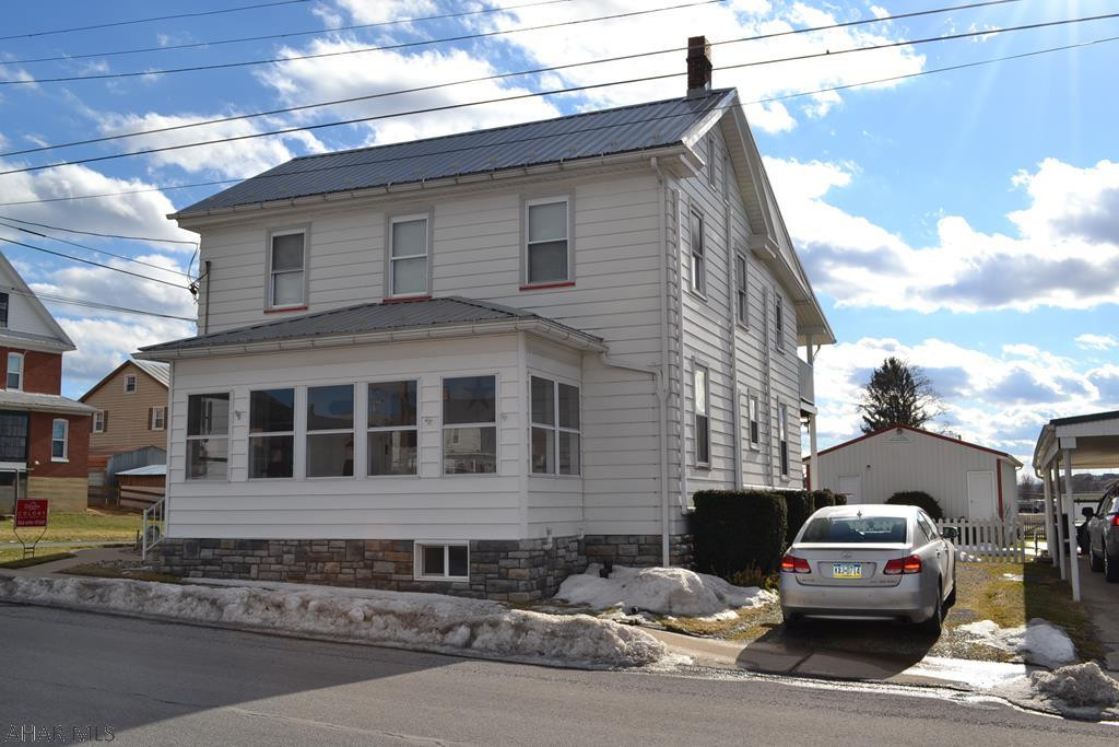 This home is located in Martinsburgh borough close to everything, the park, public pool, bowling ,library. Large rooms, updated kitchen, beautiful original hard wood floors, fenced in yard and plenty of  off street parking. Huge 3.5 car garage!! This home has mini splits for heating and cooling to keep your bills lower. The out door area is great for entertaining . This home is just waiting for a new family, this home could be a multi unit residence, the upstairs has a full kitchen and the bathroom has a washer dryer hook up.