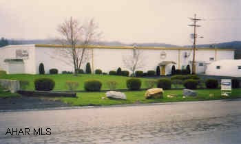 Warehouse, mostly new consturction. 20,500 sq ft old construction, 45,000 sq ft built in 2001. 6 loading docks, large lot. City water/sewer, 6 loading docks, 3 phase electric, office space, concrete floor, insulated walls andceilings, adequate lighting.