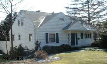 NICE CAPE COD WITH HARDWOOD FLOORS, BEAUTIFUL KITCHEN AND DECK WITH AWNING. ONE STORY LIVING.