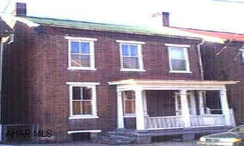 This property features all the good qualities of an older home.  Two story brick home with large rooms, high ceiligs, transom wondows, hardwood floors.  Enormous kitchen, furnace is new.