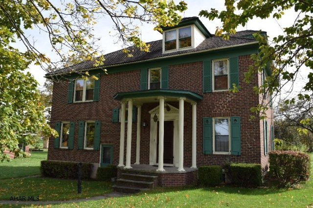 Stately 5 bedroom brick colonial with large walk up attic, large 3 car detached garage and separate work shop. Situated on 1.05 acres with your own grape arbors and numerous fruit trees. Enjoy great views from your sun porch overlooking the surrounding fields and farms. This great home has a private setting yet conveniently located only minutes from Roaring Springs and Martinsburg.