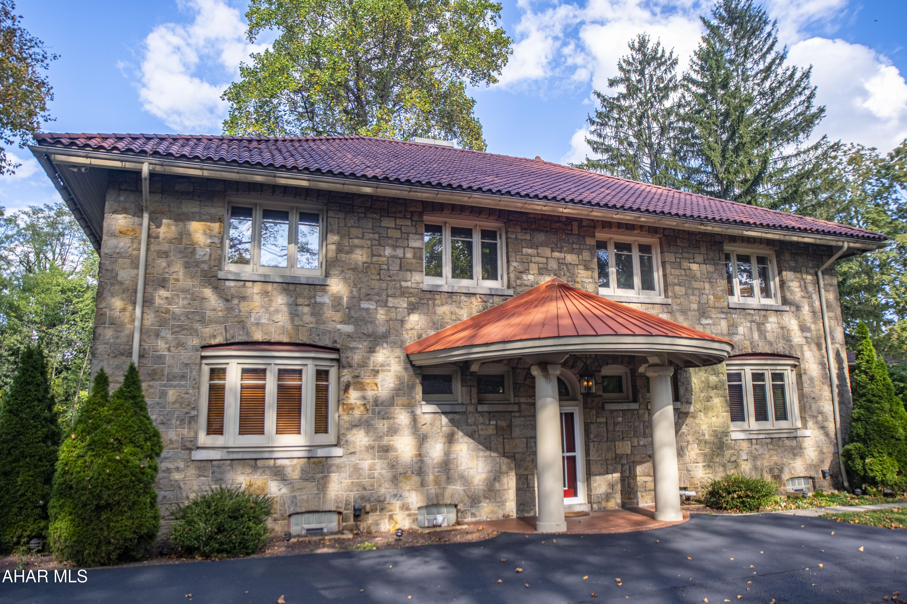 A distinguished Italian Renaissance Revival residence, this home seamlessly blends timeless architecture with refined modern comforts. Step inside to discover two gracious living rooms, each anchored by its own fireplace, and a chef's kitchen appointed with a Sub-Zero Pro refrigerator and freezer, Viking range, island sink, trash compactor, and exquisite cabinetry.

The second floor hosts four bedrooms, including a luxurious owner's suite featuring a walk-in closet, oversized tiled shower, and heated floors. A private en-suite bedroom, an additional full bath, and a large laundry room complete this level. The finished attic and basement provide versatile living, storage, and entertaining spaces.

Set on nearly an acre, the property includes a three-car garage, existing pool hookups, and a first-floor balcony. Designed with both elegance and efficiency in mind, this exceptional residence offers a rare opportunity to own a piece of architectural history, beautifully updated for today's lifestyle.