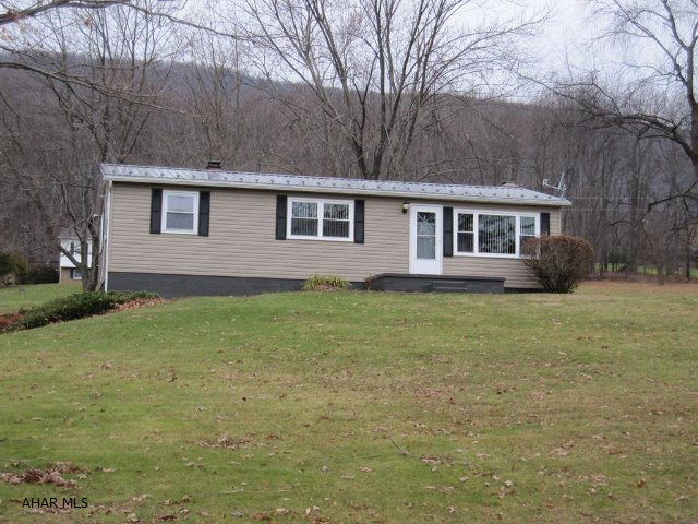 Nice, solid rancher on a full acre close to Bedford. Includes newer roof, new kitchen island, central air, newer siding and windows and large basement family room with fireplace. Also has 2 storage buildings. This home is ideal for a young family or would also be a great retirement home. Located in a very nice neighborhood.