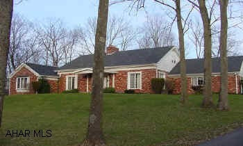 LARGE SOLID BRICK CAPE COD ON 3+ WOODED ACRES, HAS BEEN USED AS B&B. BEAUTIFUL WOODWORK THROUGHOUT, LOTS OF CLOSET SPACE AND STORAGE. BEAUTIFUL SETTING.