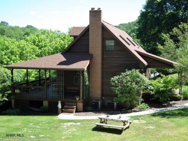 1 1/2 Cedar home surrounded by nature on 2.9 acres! Wrap around porch, covered deck in back, recently remodeled kitchen, large master suite second floor, 1 bedroom 1st floor, total 3 bedrooms, two full baths, W/I closets, a picturesque setting.