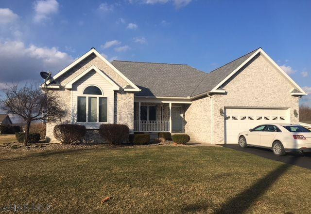 Lovely home in a quiet neighborhood. First floor has ensuite master w private patio door, master bath w granite counters, jetted tub, 3x7 shower, and 2 large walk-in closets. 2 more bedrooms on this floor along with a second full bath that boasts granite counters and a skylight. Spacious living room has marble propane fireplace and lovely hardwood floors. Open kitchen and dining room w tile floor, granite countertops, hand crafted cherry cabinets w lots of storage. Separate area for a den or office. Inviting screened-in porch off of den. Basement has a large finished rec room that is plumbed for a kitchen, 2 spacious bedrooms, full bath, utility room and lots of storage. 200 amp electric w separate panel for the basement. Hot water oil with 2 heating zones. Central air. Radon system.