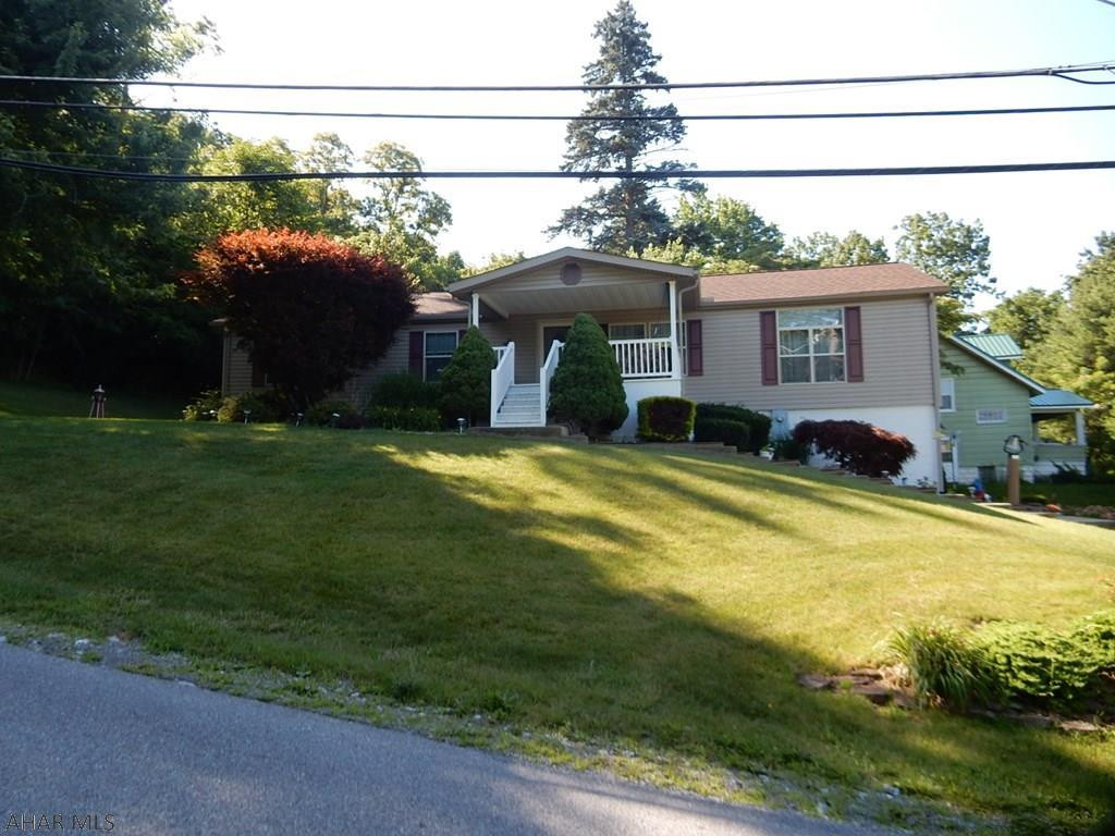BACK ON THE MARKET - NO PROBLEMS WITH PROPERTY - BUYERS CHANGED THEIR MIND. PRICED REDUCED: 
Very Nice, Well Kept home with so much gross living area for a home in this price range.  Check out this Doublewide with a full basement located on Forrest Street in Lakemont.  Step Down Living Room, Family Room, Dining Room & Kitchen provides a larger vaulted ceiling. Recently remodeled master bathroom with walk in shower. Home features 3 Bedrooms 2 baths, living room, dining room, family room, laundry. Basement feature 2 car integral garage with framed in area for recreation room, lots of built-in storage, large ceiling height and possible area for finished bathroom.  Title is retired and home is considered to be real estate.  Nice mountain view.