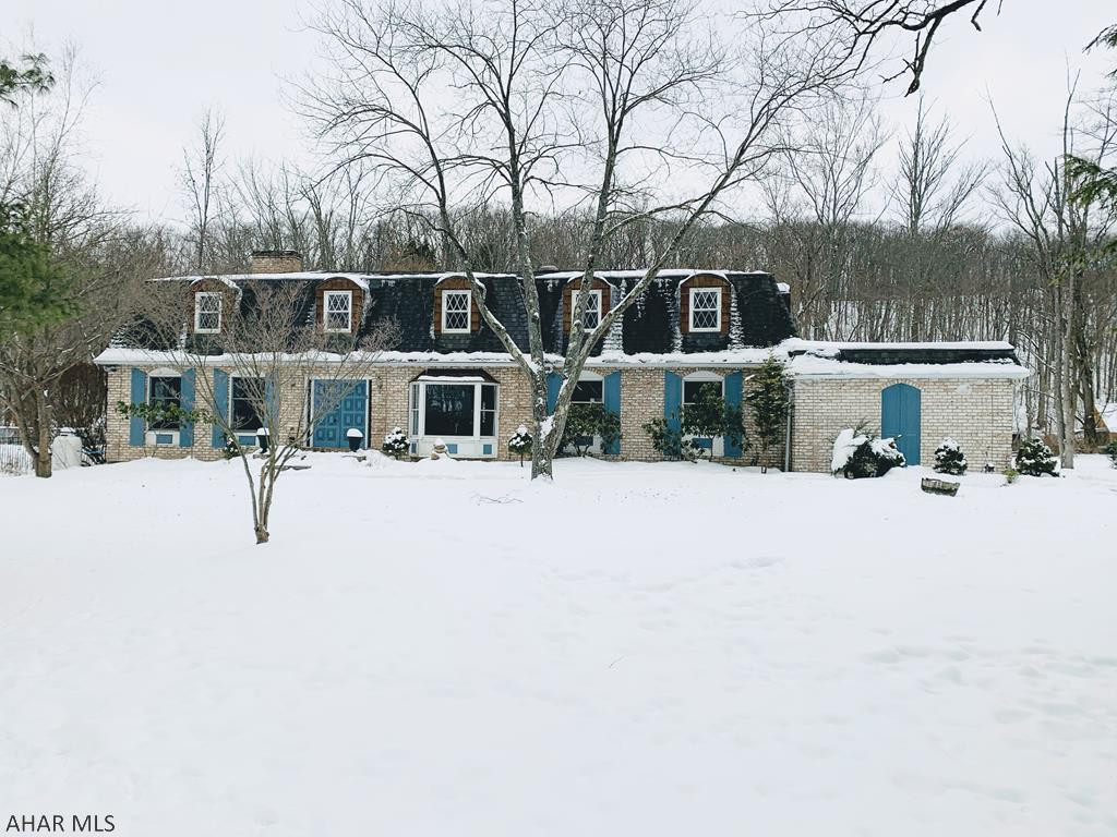 Logan township. This large 2 story 4 bd 2.5 ba home w approximately 3600sq. ft. sits on private setting of approximately 2 acres, and offers large rooms throughout. EI kitchen w cherry cabinets and granite countertops, large living room and family room w dual sided fireplace, formal dining room w hw floors, master bedroom w master bath w/in closet, a large additional living area that could be a possible  2 story in law suite that has its own entrance and balcony that overlooks the back fenced in yard. Interior of home has been freshly painted and offers newer carpet. Newer roof and furnace. Large 3 season sunroom w skylights that opens to a large deck that could be great for entertaining. Lots of storage. Large unfinished waterproofed basement. C/A. Shed.
