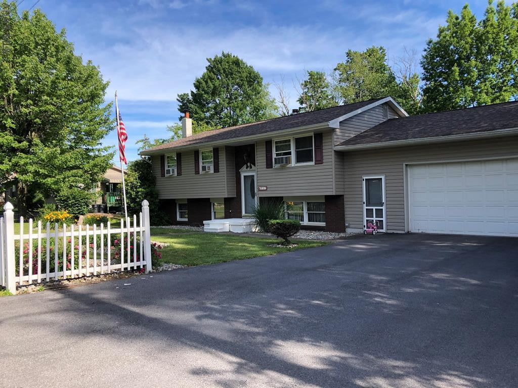 Beautiful home! Ready to move into.  Newer roof and windows.  Finished family room perfect for entertaining plus rec room/office.  Dining area leads to large deck overlooking the inground heated pool. Fenced pool & cemented pool patio. 2 car attached garage.