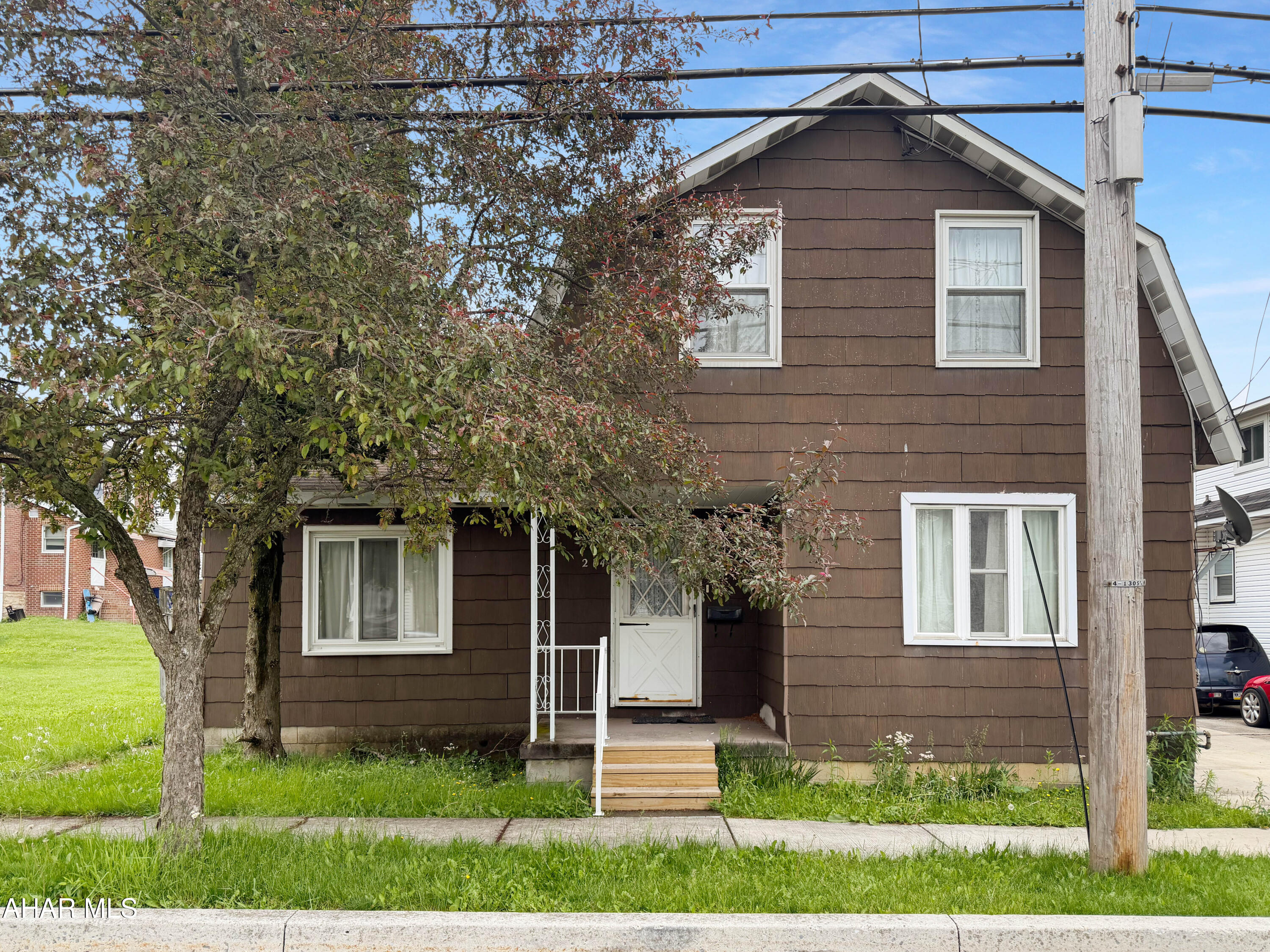 Welcome to 214 N Marian Street in the heart of the Ebensburg Borough! This estate property is full of potential and ready for the right buyer to bring it back to life. While the home does need TLC and updating, it offers solid space, character, and endless possibilities for an owner occupant, investor, or renovation project. The main floor features a spacious living room, formal dining room, large kitchen, cozy family room, and an additional bonus room that could easily serve as a first floor bedroom, office, or flex space. Upstairs you will find 3 nicely sized bedrooms and a full bathroom. The basement is unfinished but provides excellent storage space and houses the home's mechanicals. Outside, enjoy a covered front porch, rear covered patio, spacious yard, and more. Property is being sold in 'AS-IS' condition as part of an estate sale. Buyer will be responsible for any sewer testing or related requirements. Please note that all utilities are currently turned off except for electric. Call today for more information or to schedule your tour!