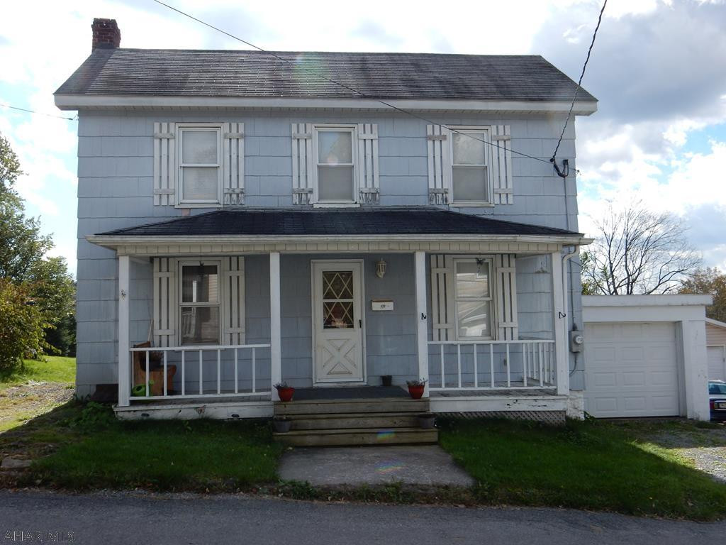 Cute 2 bedroom home, with an attached garage and additional off street parking, this home has a first floor laundry room, a deck out back and a covered front porch for entertaining or relaxing. Oil-forced air heating, a new water tank and 200 amp breaker box.