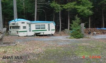 OLDER CAMPER OF LITTLE VALUE OLDER CAMPER OF LITTLE VALUE. NICE LEVEL CAMPSITE W/ STREAM