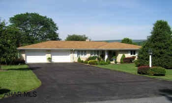 Spacious elegance, brick design, 2-car garage, quiet street, near schools. Large family room, laundry / sewing room. Big screened porch opens to private backyard w/gardens and fountains. 1 full and 2 - three quarter baths.