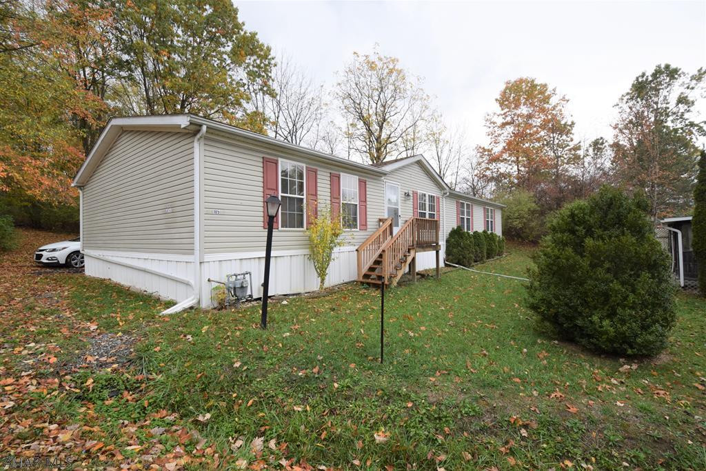 Beautiful and very spacious doublewide with over 1900 sq ft of living space in Camelot Woods Mobile Home Community.   Kitchen with center island and new refrigerator and dishwasher.   Master bedroom with huge walk-in closet and master bath with soaking tub and separate shower.  Central air.   New roof in 2019.  Nice screened porch.  Located on a private lot with big yard.  Lot rent at Camelot Woods Mobile Home Community is $378.00 per month.