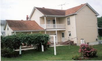 Roomy Victorian in move-in condition. Plush carpeting in living and dining rooms. New laminate flooring in farm-style kitchen. Three covered porches. First floor bonus room with laundry, gardening space, beautiful grape arbor. Additional storage room on 2nd floor.