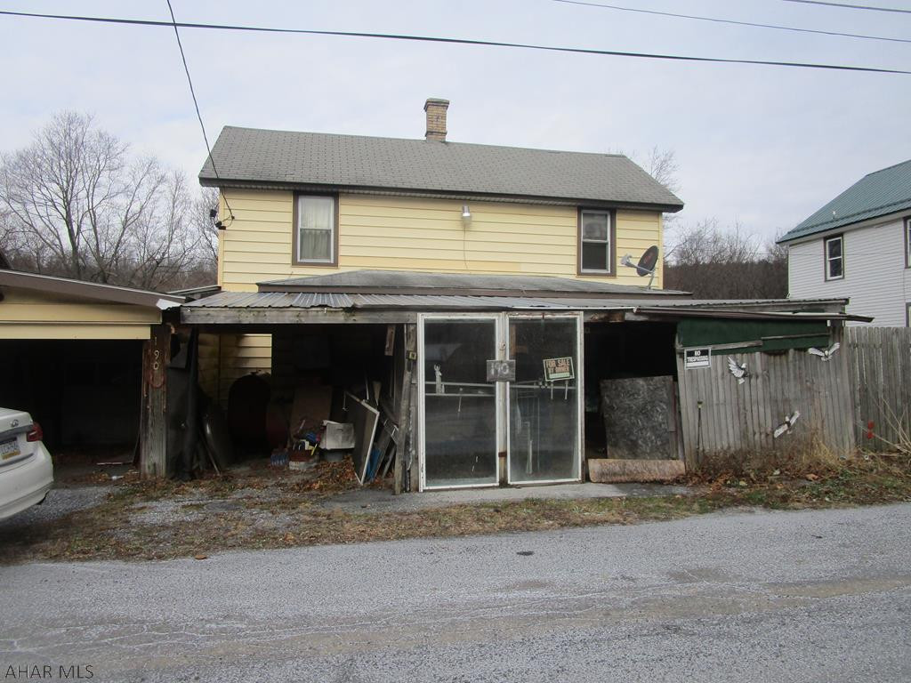 Handyman special - two story home on yellow row. Needs TLC.  Vinyl sided 3 bedroom home being sold  AS IS.  Roof leak.